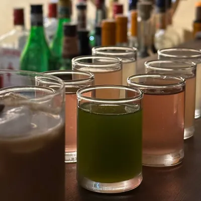 A row of house shots on the bar